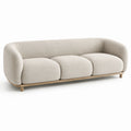 Divano a tre posti in tessuto bouclé con struttura in legno beige