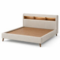 Letto matrimoniale in legno e tessuto beige con testiera contenitore
